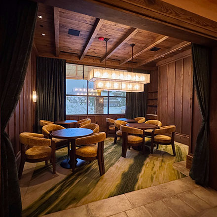 Dining room with bespoke window treatment inside Big Sky Resort restaurant M