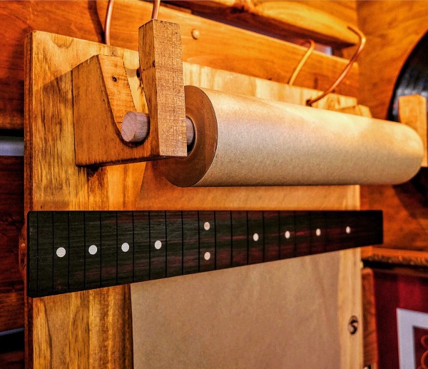 Scroll wood from discarded guitar maker's scraps.