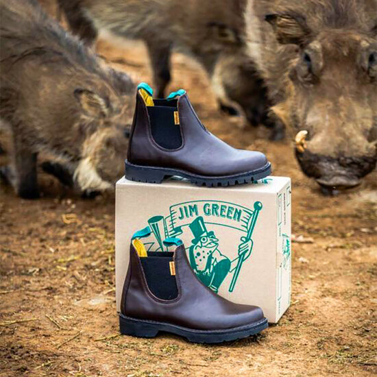 Jim Green Stockman boots in brown with wild animals in the background
