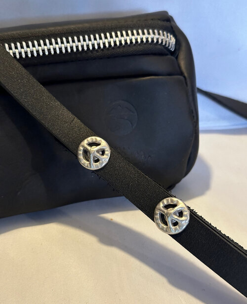Sling bag with peace sign
