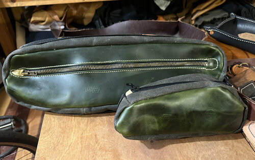 A set of top tube bag and framebag in solid green leather