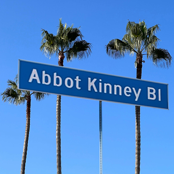 Abbot Kinney Boulevard street sign with palm trees in the background