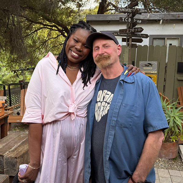 HGTV's Roast My Rental host Leslie Jones posing with Topanga Creek Outpost's Chris Kelly
