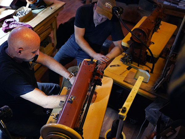 Two industrial leather sewing machines