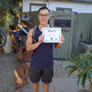 Customer poses with his ride certificate