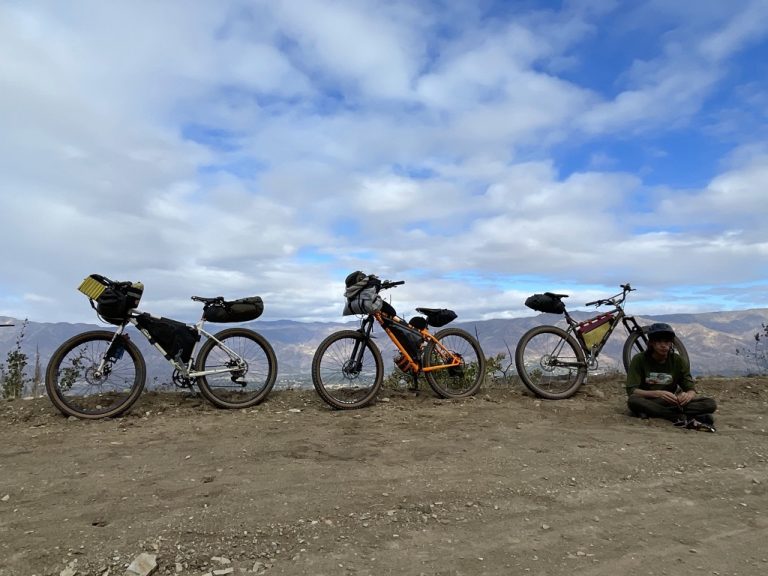 three bikepacking bicycles in the field