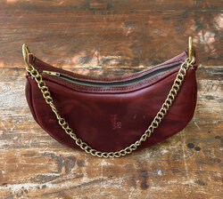 We designed a crescent bag in the coolest pull-up leather