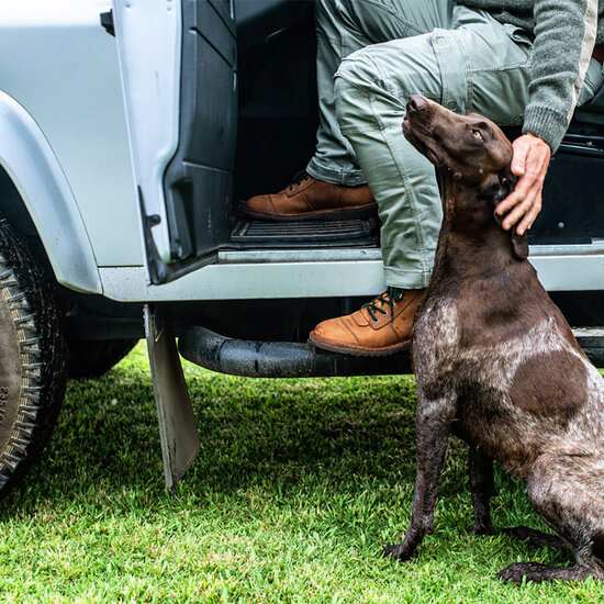 Guy wearing Jim Green African Ranger boots with dog