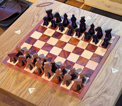One-of-a-kind leather chess set on a solid wood platform