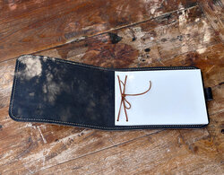 We bind the guest book with a leather lace, a true unique feature.