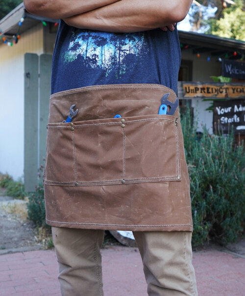 Rogue Journeymen half-size apron in brown canvas with wrenches in tool pockets