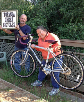 Robin is stoked with her Surly Long Haul Trucker with purple handlebar tape and purple Brooks saddle