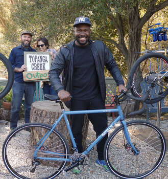 Chris wanted a bike to go on short and long trips and find new adventures. This blue Surly Disc Trucker is perfect for him.