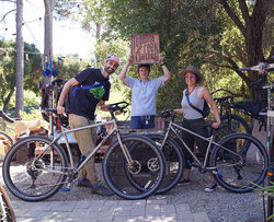 Couple showing love for a pair of matching Surly Ogres they're about to take home