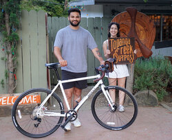 His Surly Preamble is upgraded with Brooks saddle and a stylish TCO leather handlebar bag