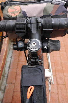 View from the cockpit using the T-bar to mount the Rohloff's grip shifter and the left side for the lighting controls and USB charging.