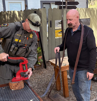 Each member of the Malibu Search and Rescue Team gets to press rivets onto their own belt