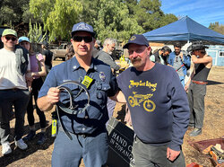 A fireman from Topanga Fire Dept Station 69 receives a free belt from us at a Belt Brigade event