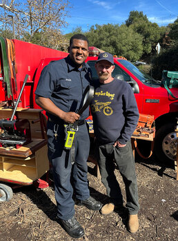 A fireman from Topanga Fire Dept Station 69 receives a free belt from us at a Belt Brigade event