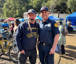 A fireman from Topanga Fire Dept Station 69 receives a free belt from us at a Belt Brigade event
