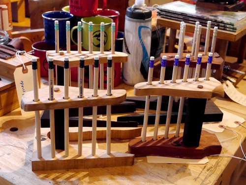 Pencil holders made out of repurposed guitar headstock