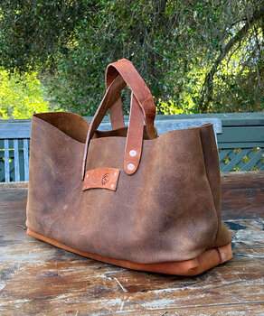 Organizer bag in buffalo hide to hold craft supplies, tools, and more